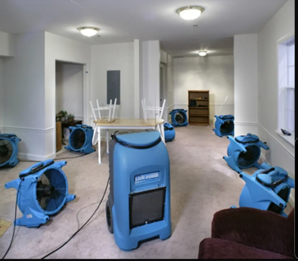 Air movers and dehumidifier setup for Water Damage Restoration in Lenoir